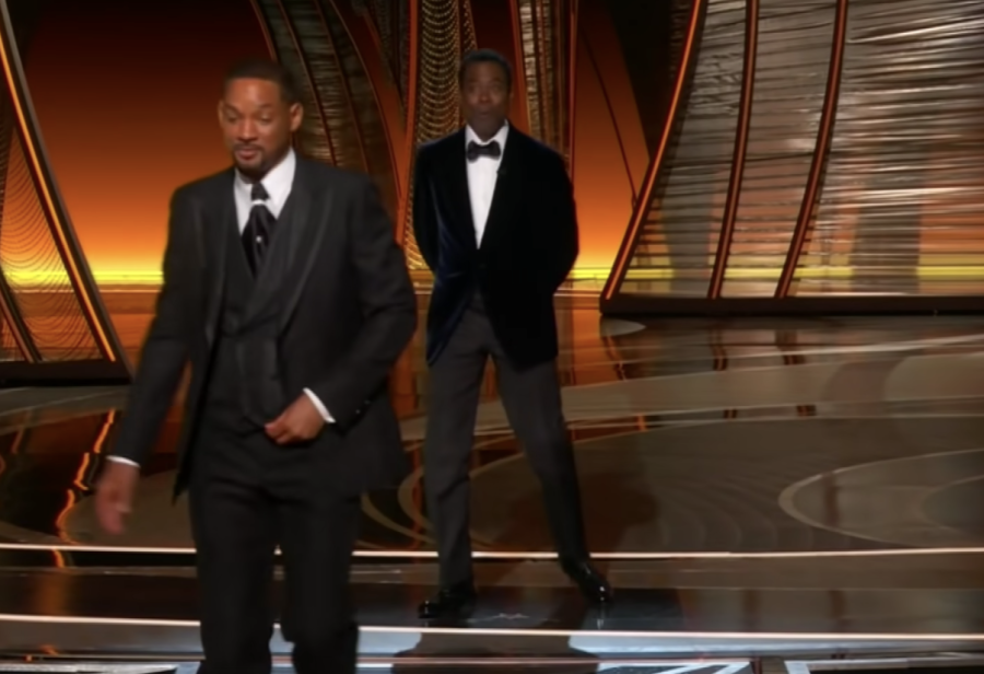 Will Smith walks off the stage after slapping Chris Rock for making a joke about his wife, Jada Pinkett Smiths appearance due to alopecia. 