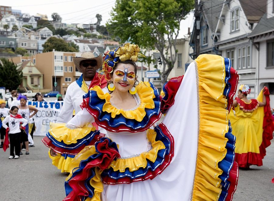 A woman is dressed in Hispanic attire at Carnaval in San Francisco, California in Honor of Hispanic Heritage Month. 