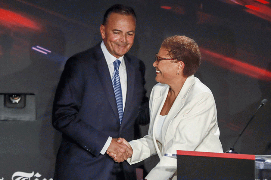 Caruso and Bass greeting each other after their Debate on September 21. 
