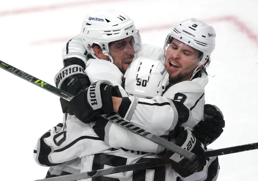 Los Angeles Kings players Anze Kopitar, Adrian Kempe, and Sean Durzi celebrate a goal scored. If you can, go see the LA Kings play at Crypto.com Arena! Tickets mostly start at $20 and the experience is so fun! (Stephen R. Sylvanie-USA TODAY Sports)