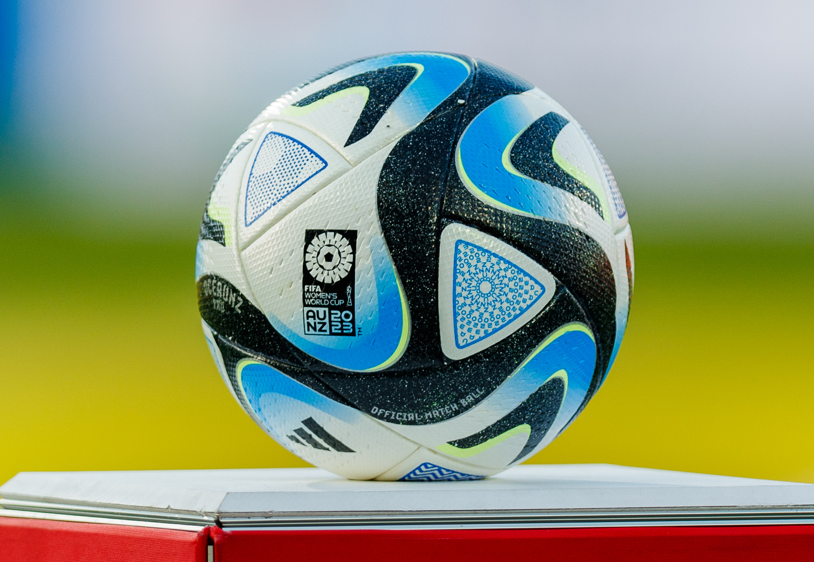 The Adidas Oceaunz ball, the official matchball of the 2023 FIFA Women’s World Cup, is different from the design used in the semi-finals, third place game, and the final, the Adidas Oceaunz Final Pro. This ball has an orange and gold coloration, similar to a sunset.