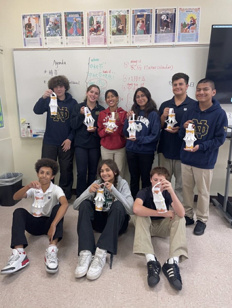 Notre Dame students in the Chinese I class hold their handmade lanterns in celebration of the Mid-Autumn Festival. From left to right: name, Lily Torres ‘27, 
