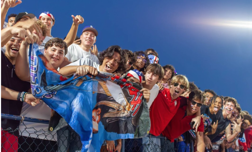 The student section during the “Red, White, and Blue” themed game from the 2023-2024 football season.