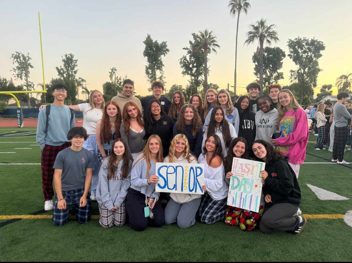 Senior ASB enjoying senior sunrise with their peers after planning this event for weeks. Some ASB members are holding signs they made just for today's sunrise.  