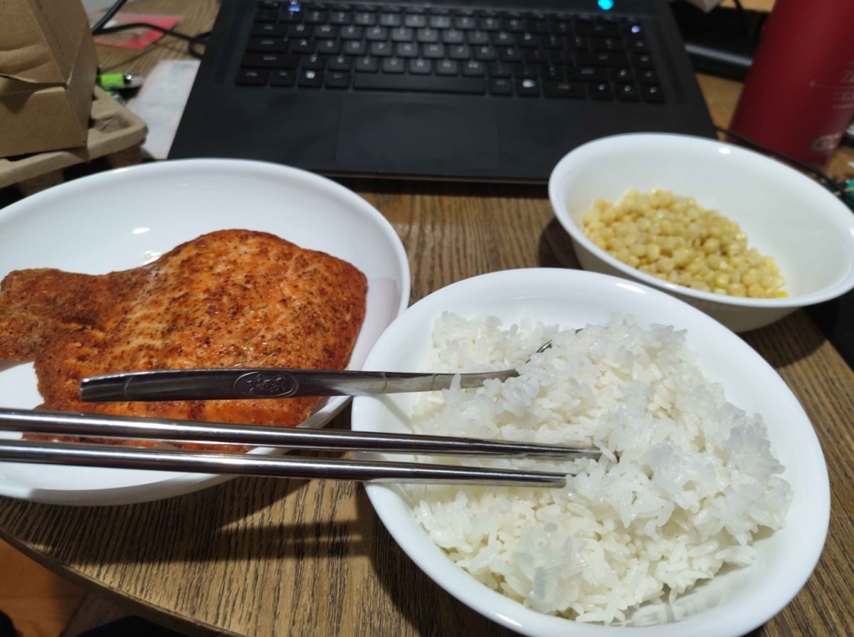 Nolan Cheng ‘25 dines upon his favorite comfort food, salmon and rice.