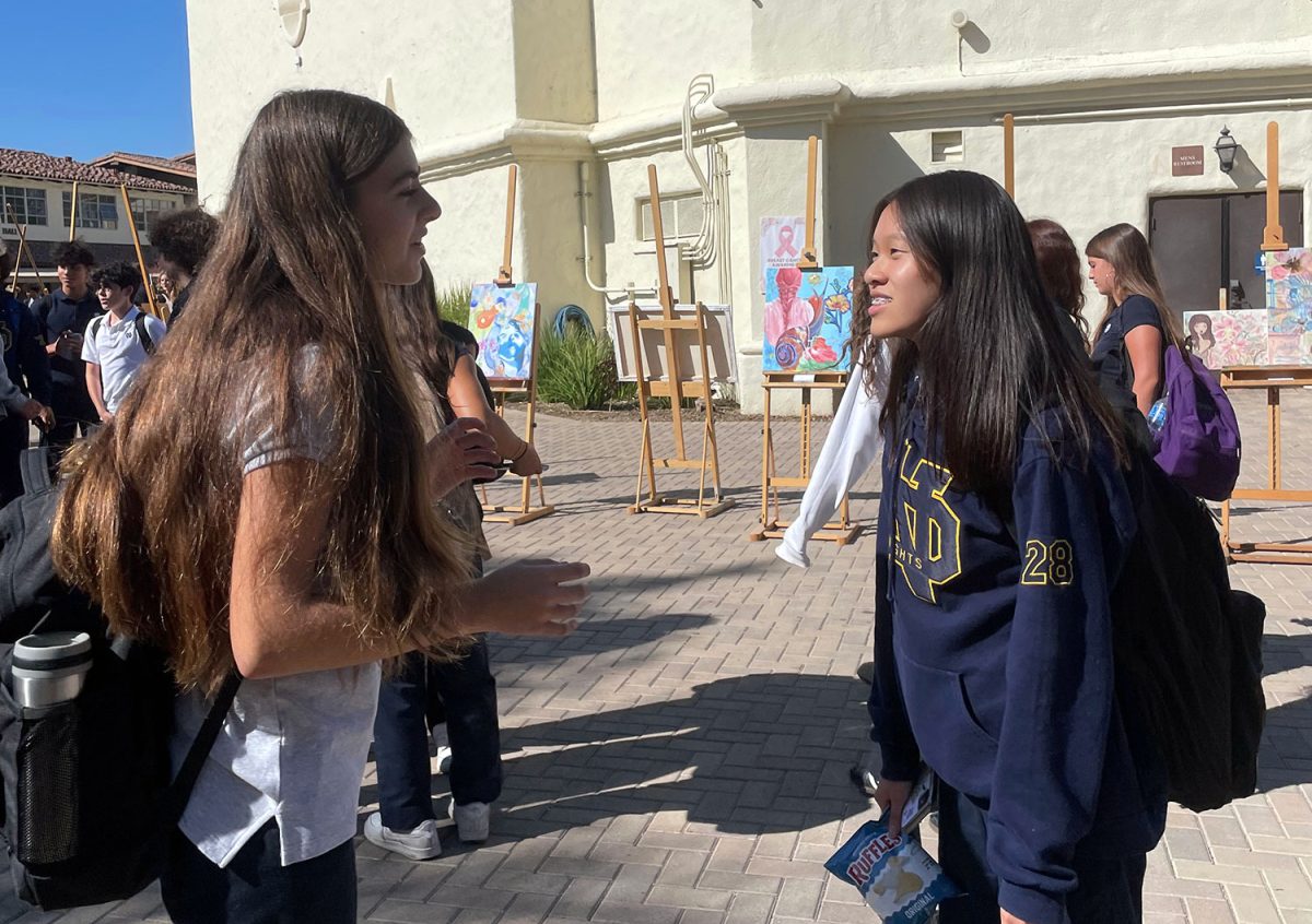 Former public school student Vivienne Tarassians ‘28 and former catholic school student Nicole Ching ‘28 learn to navigate freshman year together. 