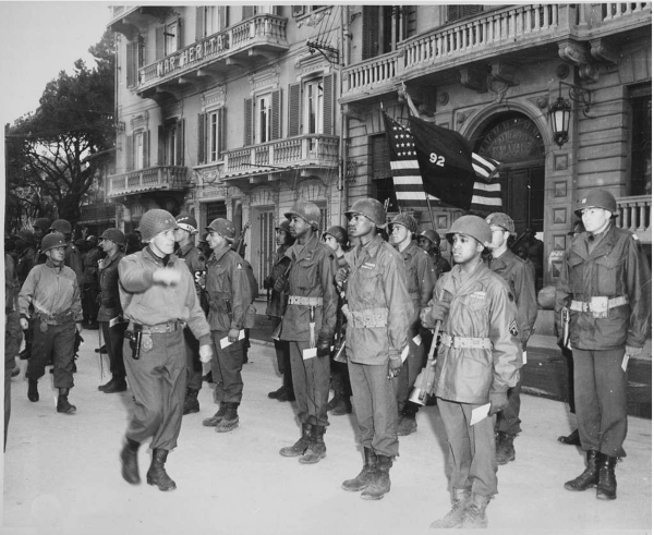 Major General Edward M. Almond, commanding general of the 92nd Infantry Division, inspecting his troops in Italy in 1945. 