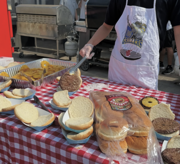 ND Griller's cook up their famous teriyaki burgers to sell at lunch.